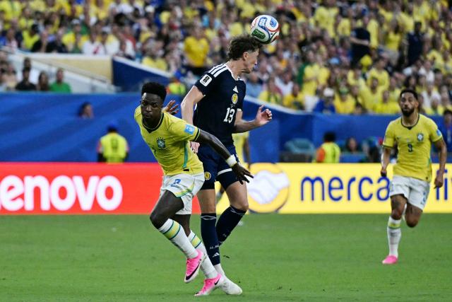 Brazil's forward #07 Vinicius Junior and Scotland's defender #13 Jack Hendry fight for the ball during the 2026 World Cup Group C football match between Scotland and Brazil at the Miami Stadium in Miami Gardens on June 24, 2026.  (Photo by CHANDAN KHANNA / AFP)
