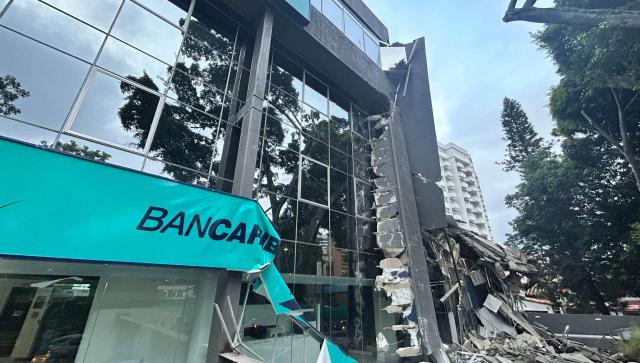 Picture of a Bancaribe building that collapsed after an earthquake in Caracas on June 24, 2026. A magnitude 7.1 earthquake struck Venezuela on Wednesday, the United States Geological Survey (USGS) reported, triggering panic in Caracas, according to AFP journalists. The tremor, which was followed by several aftershocks, was also felt in Colombia. (Photo by Juan BARRETO / AFP)