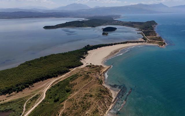 This general view shows the beach of a natural protected area in Zvernec, near Vlora on June 18, 2026. (Photo by Adnan Beci / AFP)