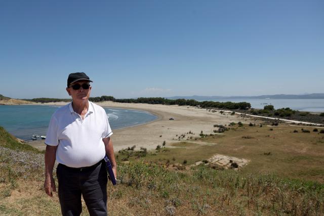 Minella Balliu, 68, one of the claimed landowners in Zvernec, poses near a beach in Zvernec, near Vlora on June 18, 2026. (Photo by Adnan Beci / AFP)