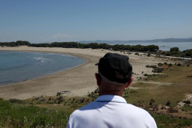 Minella Balliu, 68, one of the claimed landowners in Zvernec, overlooks a beach in Zvernec, near Vlora on June 18, 2026. (Photo by Adnan Beci / AFP)