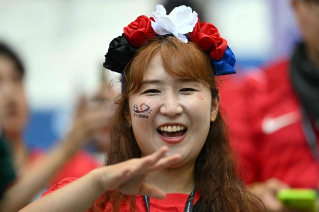 A South Korean fan arrives to watch the 2026 World Cup Group A football match between South Africa and South Korea at the Monterrey Stadium in Guadalupe, Mexico, on June 24, 2026.  (Photo by Yuri CORTEZ / AFP)