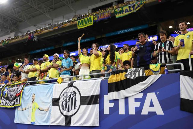 Brazilian fans cheer during the 2026 World Cup Group C football match between Scotland and Brazil at the Miami Stadium in Miami Gardens on June 24, 2026.  (Photo by PATRICIA DE MELO MOREIRA / AFP)
