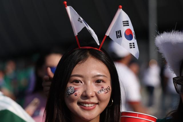 A South Korean fan arrives to watch the 2026 World Cup Group A football match between South Africa and South Korea at the Monterrey Stadium in Guadalupe, Mexico, on June 24, 2026.  (Photo by Julio Cesar AGUILAR / AFP)