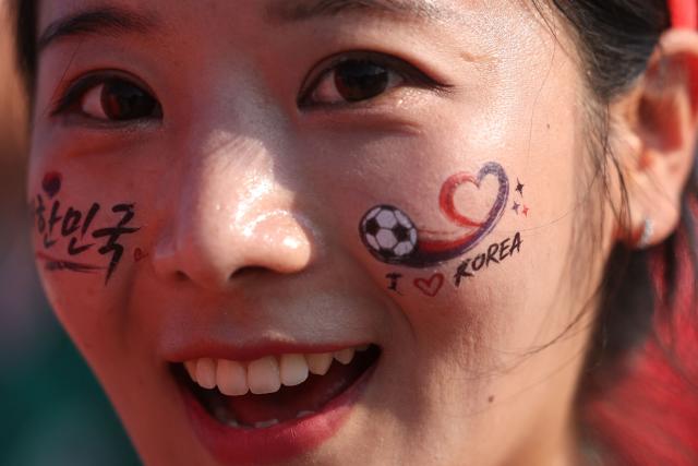 A South Korean fan arrives to watch the 2026 World Cup Group A football match between South Africa and South Korea at the Monterrey Stadium in Guadalupe, Mexico, on June 24, 2026.  (Photo by Julio Cesar AGUILAR / AFP)