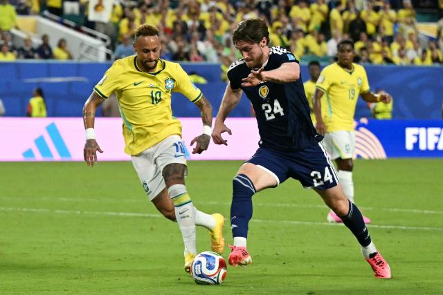 Brazil's forward #10 Neymar and Scotland's defender #24 Anthony Ralston fight for the ball during the 2026 World Cup Group C football match between Scotland and Brazil at the Miami Stadium in Miami Gardens on June 24, 2026.  (Photo by CHANDAN KHANNA / AFP)