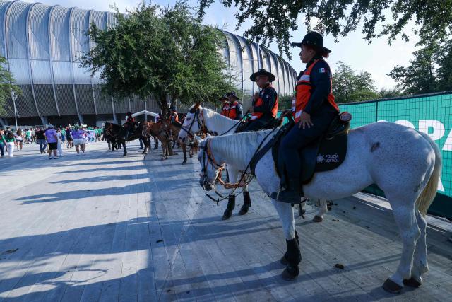 Mounted police officers provide security as fans arrive to watch the 2026 World Cup Group A football match between South Africa and South Korea at the Monterrey Stadium in Guadalupe, Mexico, on June 24, 2026.  (Photo by Julio Cesar AGUILAR / AFP)