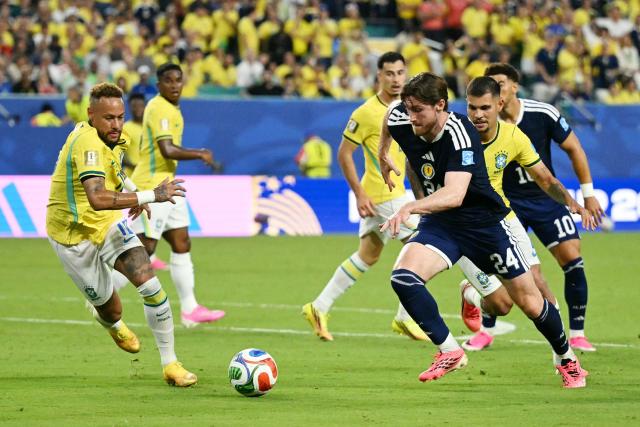 Brazil's forward #10 Neymar and Scotland's defender #24 Anthony Ralston fight for the ball during the 2026 World Cup Group C football match between Scotland and Brazil at the Miami Stadium in Miami Gardens on June 24, 2026.  (Photo by CHANDAN KHANNA / AFP)