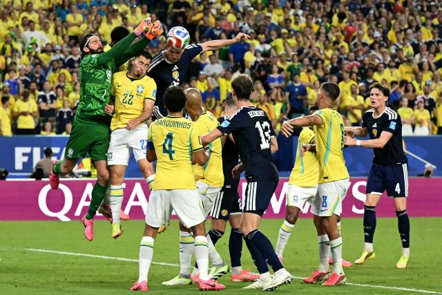 Brazil's goalkeeper #01 Alisson clears the ball during the 2026 World Cup Group C football match between Scotland and Brazil at the Miami Stadium in Miami Gardens on June 24, 2026.  (Photo by CHANDAN KHANNA / AFP)