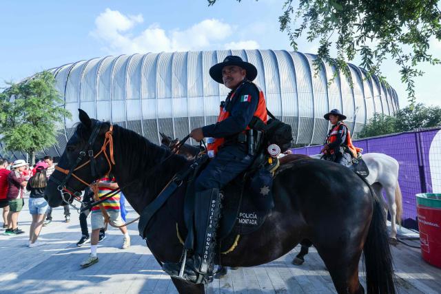Mounted police officers provide security as fans arrive to watch the 2026 World Cup Group A football match between South Africa and South Korea at the Monterrey Stadium in Guadalupe, Mexico, on June 24, 2026.  (Photo by Julio Cesar AGUILAR / AFP)