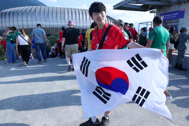 A South Korean fan arrives to watch the 2026 World Cup Group A football match between South Africa and South Korea at the Monterrey Stadium in Guadalupe, Mexico, on June 24, 2026.  (Photo by Julio Cesar AGUILAR / AFP)