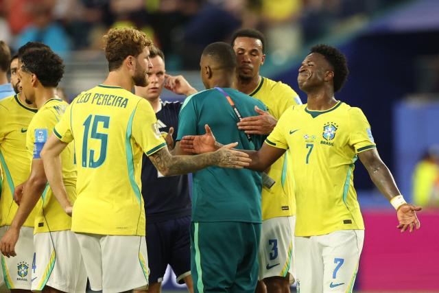 Brazil's defender #15 Leo Pereira and forward #07 Vinicius Junior celebrate after winning the 2026 World Cup Group C football match between Scotland and Brazil at the Miami Stadium in Miami Gardens on June 24, 2026.  (Photo by PATRICIA DE MELO MOREIRA / AFP)