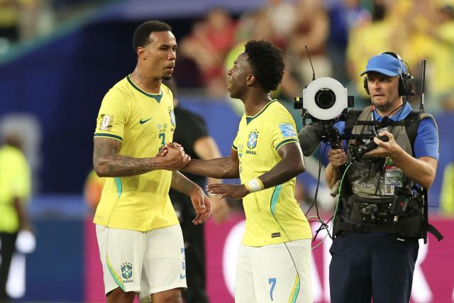 Brazil's defender #03 Gabriel Magalhaes and forward #07 Vinicius Junior celebrate after winning the 2026 World Cup Group C football match between Scotland and Brazil at the Miami Stadium in Miami Gardens on June 24, 2026.  (Photo by PATRICIA DE MELO MOREIRA / AFP)