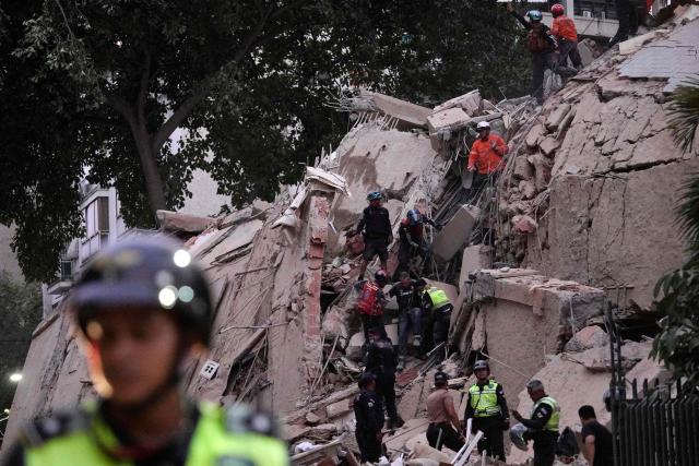 Rescue workers evacuate an injured person from a collapsed building following an earthquake in Caracas on June 24, 2026. A magnitude 7.1 earthquake struck Venezuela on Wednesday, the United States Geological Survey (USGS) reported, triggering panic in Caracas, according to AFP journalists. The tremor, which was followed by several aftershocks, was also felt in Colombia. (Photo by Manaure Quintero / AFP)