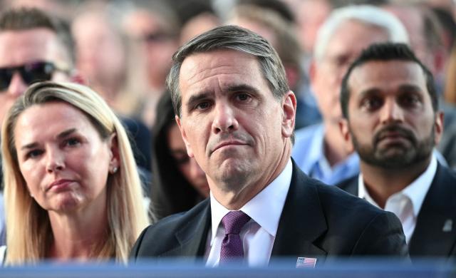 Acting US Attorney General Todd Blanche (C) and FBI Director Kash Patel (R) listen to a speaker during a kick-off celebration for the "Great American State Fair" on the National Mall in Washington, DC, June 24, 2026. The "Great American State Fair" will be held from June 25 to July 10, 2026, to celebrate the 250th anniversary of US independence. (Photo by Mandel NGAN / AFP)