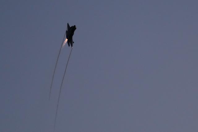 An F-35 flies overhead with its afterburner during a kick-off celebration for the "Great American State Fair" on the National Mall in Washington, DC, June 24, 2026. The "Great American State Fair" will be held from June 25 to July 10, 2026, to celebrate the 250th anniversary of US independence. (Photo by Ken Cedeno / AFP)