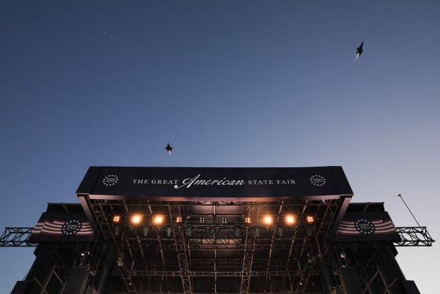 Two F-35s fly overhead the stage with their afterburners during a kick-off celebration for the "Great American State Fair" on the National Mall in Washington, DC, June 24, 2026. The "Great American State Fair" will be held from June 25 to July 10, 2026, to celebrate the 250th anniversary of US independence. (Photo by Jemal COUNTESS / AFP)