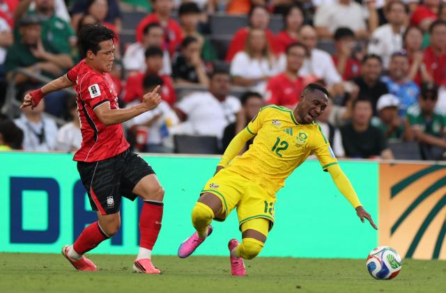 South Africa's forward #12 Thapelo Maseko reacts in pain as he fights for the ball during the 2026 World Cup Group A football match between South Africa and South Korea at the Monterrey Stadium in Guadalupe, Mexico, on June 24, 2026.  (Photo by Julio Cesar AGUILAR / AFP)