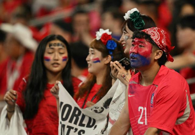South Korean fans watch from the stands the 2026 World Cup Group A football match between South Africa and South Korea at the Monterrey Stadium in Guadalupe, Mexico, on June 24, 2026.  (Photo by Yuri CORTEZ / AFP)