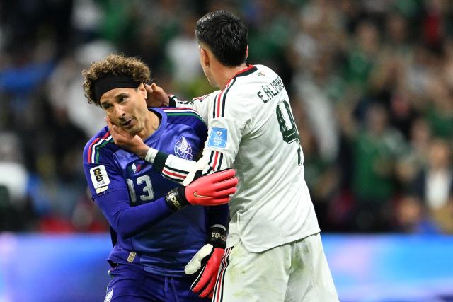 Mexico's goalkeeper #13 Guillermo Ochoa hugs teammate midfielder #04 Edson Alvarez as he is substituted in during the 2026 World Cup Group A football match between the Czech Republic and Mexico at the Mexico City Stadium in Mexico City on June 24, 2026.  (Photo by CARL DE SOUZA / AFP)