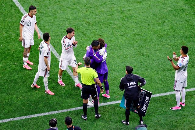 Mexico's goalkeeper #13 Guillermo Ochoa greets teammate goalkeeper #01 Raul Rangel as he is substituted in during the 2026 World Cup Group A football match between the Czech Republic and Mexico at the Mexico City Stadium in Mexico City on June 24, 2026.  (Photo by Rodrigo Oropeza / AFP)