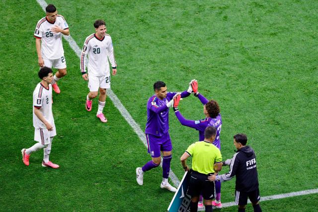 Mexico's goalkeeper #13 Guillermo Ochoa greets teammate goalkeeper #01 Raul Rangel as he is substituted in during the 2026 World Cup Group A football match between the Czech Republic and Mexico at the Mexico City Stadium in Mexico City on June 24, 2026.  (Photo by Rodrigo Oropeza / AFP)