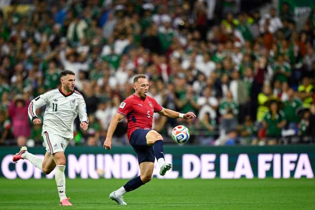 Czech Republic's defender #05 Vladimir Coufal controls the ball past Mexico's forward #11 Santiago Gimenez during the 2026 World Cup Group A football match between the Czech Republic and Mexico at the Mexico City Stadium in Mexico City on June 24, 2026.  (Photo by Alfredo ESTRELLA / AFP)