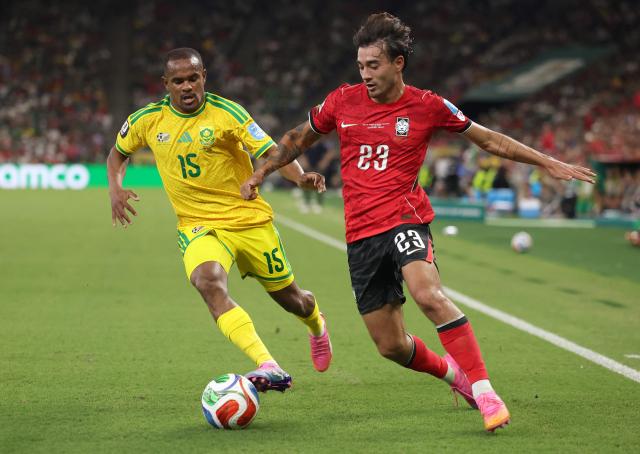 South Korea's defender #23 Jens Castrop and South Africa's forward #15 Iqraam Rayners fight for the ball during the 2026 World Cup Group A football match between South Africa and South Korea at the Monterrey Stadium in Guadalupe, Mexico, on June 24, 2026.  (Photo by Julio Cesar AGUILAR / AFP)