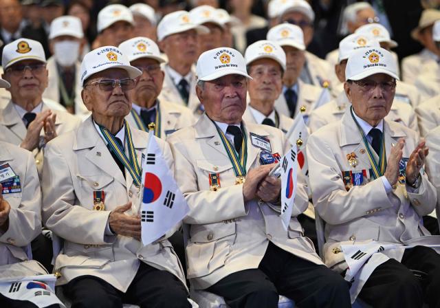 South Korean war veterans attend a ceremony marking the 76th anniversary of the outbreak of the Korean War in Suwon on June 25, 2026. (Photo by Jung Yeon-je / AFP)