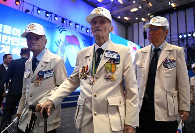 South Korean war veterans attend a ceremony marking the 76th anniversary of the outbreak of the Korean War in Suwon on June 25, 2026. (Photo by Jung Yeon-je / AFP)