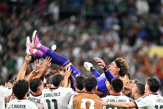 Mexico's players lift up goalkeeper #13 Guillermo Ochoa after winning the 2026 World Cup Group A football match between the Czech Republic and Mexico at the Mexico City Stadium in Mexico City on June 24, 2026.  (Photo by CARL DE SOUZA / AFP)