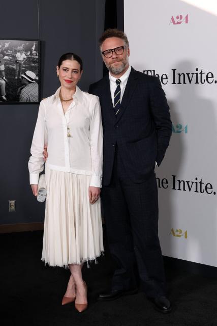 Canadian actor Seth Rogen (R) and wife Lauren Miller Rogen attend the Los Angeles premiere of "The Invite" at the Directors Guild of America Theater in Los Angeles on June 23, 2026. (Photo by VALERIE MACON / AFP)