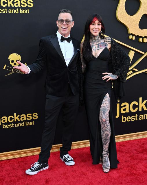 British-US stunt performer Steve Glover aka Steve-O and Koral Bickel attend the Los Angeles premiere of "Jackass: Best and Last" at the Paramount Theatre in Los Angeles on June 23, 2026. (Photo by LISA O'CONNOR / AFP)