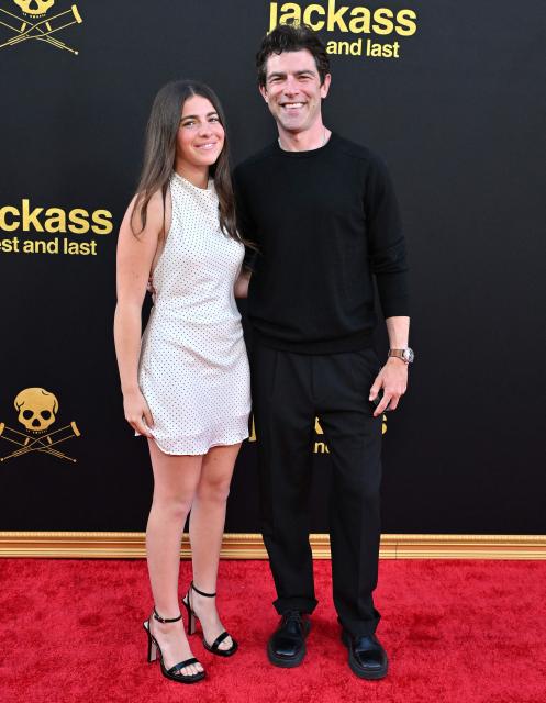 Lilly Greenfield and US actor Max Greenfield attend the Los Angeles premiere of "Jackass: Best and Last" at the Paramount Theatre in Los Angeles on June 23, 2026. (Photo by LISA O'CONNOR / AFP)