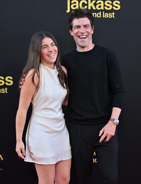 Lilly Greenfield and US actor Max Greenfield attend the Los Angeles premiere of "Jackass: Best and Last" at the Paramount Theatre in Los Angeles on June 23, 2026. (Photo by LISA O'CONNOR / AFP)