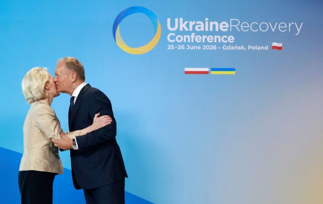 Polish Prime Minister Donald Tusk (R) welcomes European Commission President Ursula von der Leyen as she arrives to attend the Ukraine Recovery Conference (URC 2026) in Gdansk, Poland, on June 25, 2026. The Ukraine Recovery Conference (URC 2026), co-hosted by Poland and Ukraine, takes place in Gdansk on June 25–26, 2026, aiming to strengthen support for Ukraine’s reconstruction and boost investment, with a focus on energy, critical infrastructure, and logistics sectors. (Photo by Wojtek RADWANSKI / AFP)