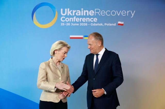 Polish Prime Minister Donald Tusk (R) welcomes European Commission President Ursula von der Leyen as she arrives to attend the Ukraine Recovery Conference (URC 2026) in Gdansk, Poland, on June 25, 2026. The Ukraine Recovery Conference (URC 2026), co-hosted by Poland and Ukraine, takes place in Gdansk on June 25–26, 2026, aiming to strengthen support for Ukraine’s reconstruction and boost investment, with a focus on energy, critical infrastructure, and logistics sectors. (Photo by Wojtek RADWANSKI / AFP)