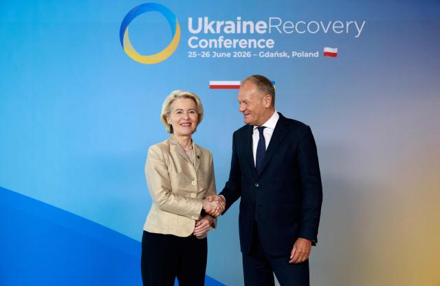Polish Prime Minister Donald Tusk (R) welcomes European Commission President Ursula von der Leyen as she arrives to attend the Ukraine Recovery Conference (URC 2026) in Gdansk, Poland, on June 25, 2026. The Ukraine Recovery Conference (URC 2026), co-hosted by Poland and Ukraine, takes place in Gdansk on June 25–26, 2026, aiming to strengthen support for Ukraine’s reconstruction and boost investment, with a focus on energy, critical infrastructure, and logistics sectors. (Photo by Wojtek RADWANSKI / AFP)