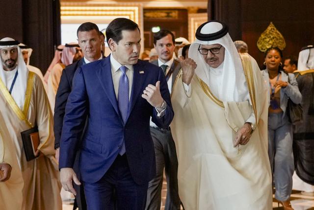 US Secretary of State Marco Rubio (L) walks along side Bahrain's Foreign Minister and Chairman of the GCC Ministerial Council session Abdullatif bin Rashid al-Zayani following a meeting with foreign ministers of the Gulf Cooperation Council Member States (GCC), in Manama on June 25, 2026. Top US diplomat Marco Rubio was in Bahrain on June 25, after promising Gulf allies that Washington would protect their interests as it seeks to hammer out a final settlement to end the war with Iran. Rubio is on a regional tour to reassure the Gulf states, which were targeted by Tehran's missiles and drones during the conflict and saw their crucial oil and gas shipments effectively cut off by an Iranian blockade of the Strait of Hormuz. (Photo by Eric Lee / POOL / AFP)