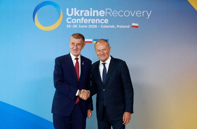 Polish Prime Minister Donald Tusk (R) welcomes European Czech Republic's Prime Minister Andrej Babis as he arrives to attend the Ukraine Recovery Conference (URC 2026) in Gdansk, Poland, on June 25, 2026. The Ukraine Recovery Conference (URC 2026), co-hosted by Poland and Ukraine, takes place in Gdansk on June 25–26, 2026, aiming to strengthen support for Ukraine’s reconstruction and boost investment, with a focus on energy, critical infrastructure, and logistics sectors. (Photo by Wojtek RADWANSKI / AFP)