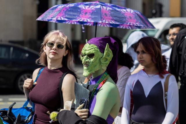 Spider-man fans wait for a promotional event for the upcoming premiere of the film "Spider-Man: Brand New Day", in central London on June 25, 2026. The red carpet photo call event was scaled back due to the extreme heat parts in England this week. (Photo by Brook Mitchell / AFP)