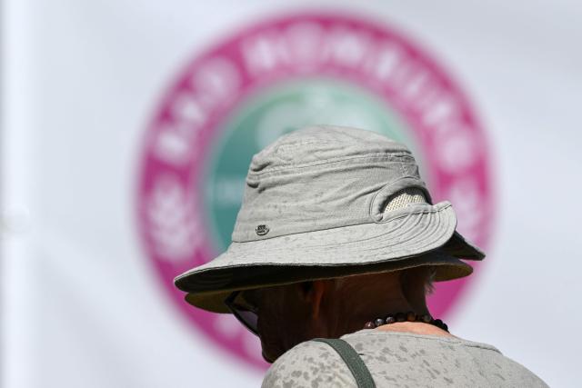 A woman wears a hat to protect against the sun at the WTA 500 Bad Homburg Open tennis tournament in Bad Homburg, western Germany on June 25, 2026. (Photo by Kirill KUDRYAVTSEV / AFP)