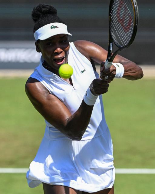 USA's Venus Williams hits a return as she plays with Philippines' Alexandra Eala against Britain's Olivia Nicholls and Russia's Tereza Mihalikova during the women's doubles quarter-final match of the WTA 500 Bad Homburg Open tennis tournament in Bad Homburg, western Germany on June 25, 2026. (Photo by Kirill KUDRYAVTSEV / AFP)