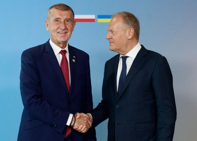 Polish Prime Minister Donald Tusk (R) welcomes European Czech Republic's Prime Minister Andrej Babis as he arrives to attend the Ukraine Recovery Conference (URC 2026) in Gdansk, Poland, on June 25, 2026. The Ukraine Recovery Conference (URC 2026), co-hosted by Poland and Ukraine, takes place in Gdansk on June 25–26, 2026, aiming to strengthen support for Ukraine’s reconstruction and boost investment, with a focus on energy, critical infrastructure, and logistics sectors. (Photo by Wojtek RADWANSKI / AFP)
