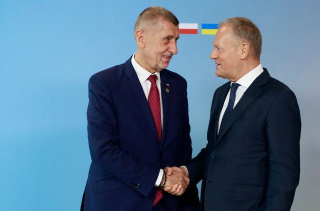 Polish Prime Minister Donald Tusk (R) welcomes European Czech Republic's Prime Minister Andrej Babis as he arrives to attend the Ukraine Recovery Conference (URC 2026) in Gdansk, Poland, on June 25, 2026. The Ukraine Recovery Conference (URC 2026), co-hosted by Poland and Ukraine, takes place in Gdansk on June 25–26, 2026, aiming to strengthen support for Ukraine’s reconstruction and boost investment, with a focus on energy, critical infrastructure, and logistics sectors. (Photo by Wojtek RADWANSKI / AFP)