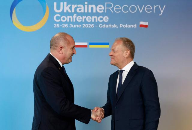 Polish Prime Minister Donald Tusk (R) welcomes Bulgaria's Prime Minister Rumen Radev as he arrives to attend the Ukraine Recovery Conference (URC 2026) in Gdansk, Poland, on June 25, 2026. The Ukraine Recovery Conference (URC 2026), co-hosted by Poland and Ukraine, takes place in Gdansk on June 25–26, 2026, aiming to strengthen support for Ukraine’s reconstruction and boost investment, with a focus on energy, critical infrastructure, and logistics sectors. (Photo by Wojtek RADWANSKI / AFP)