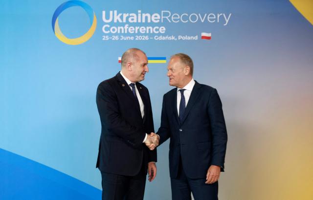 Polish Prime Minister Donald Tusk (R) welcomes Bulgaria's Prime Minister Rumen Radev as he arrives to attend the Ukraine Recovery Conference (URC 2026) in Gdansk, Poland, on June 25, 2026. The Ukraine Recovery Conference (URC 2026), co-hosted by Poland and Ukraine, takes place in Gdansk on June 25–26, 2026, aiming to strengthen support for Ukraine’s reconstruction and boost investment, with a focus on energy, critical infrastructure, and logistics sectors. (Photo by Wojtek RADWANSKI / AFP)