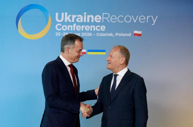 Polish Prime Minister Donald Tusk (R) welcomes the Administrator of the United Nations Development Programme (UNDP) Alexander De Croo as he arrives to attend the Ukraine Recovery Conference (URC 2026) in Gdansk, Poland, on June 25, 2026. The Ukraine Recovery Conference (URC 2026), co-hosted by Poland and Ukraine, takes place in Gdansk on June 25–26, 2026, aiming to strengthen support for Ukraine’s reconstruction and boost investment, with a focus on energy, critical infrastructure, and logistics sectors. (Photo by Wojtek RADWANSKI / AFP)