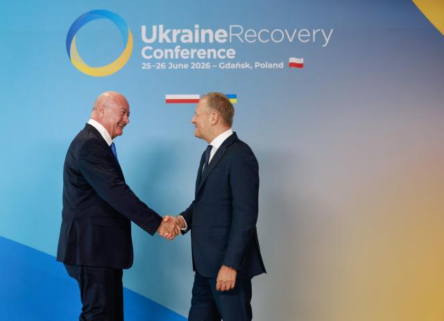 Polish Prime Minister Donald Tusk (R) welcomes Austrian Chancellor Christian Stocker as he arrives to attend the Ukraine Recovery Conference (URC 2026) in Gdansk, Poland, on June 25, 2026. The Ukraine Recovery Conference (URC 2026), co-hosted by Poland and Ukraine, takes place in Gdansk on June 25–26, 2026, aiming to strengthen support for Ukraine’s reconstruction and boost investment, with a focus on energy, critical infrastructure, and logistics sectors. (Photo by Wojtek RADWANSKI / AFP)