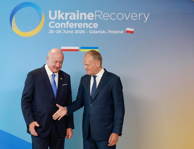 Polish Prime Minister Donald Tusk (R) welcomes Austrian Chancellor Christian Stocker as he arrives to attend the Ukraine Recovery Conference (URC 2026) in Gdansk, Poland, on June 25, 2026. The Ukraine Recovery Conference (URC 2026), co-hosted by Poland and Ukraine, takes place in Gdansk on June 25–26, 2026, aiming to strengthen support for Ukraine’s reconstruction and boost investment, with a focus on energy, critical infrastructure, and logistics sectors. (Photo by Wojtek RADWANSKI / AFP)